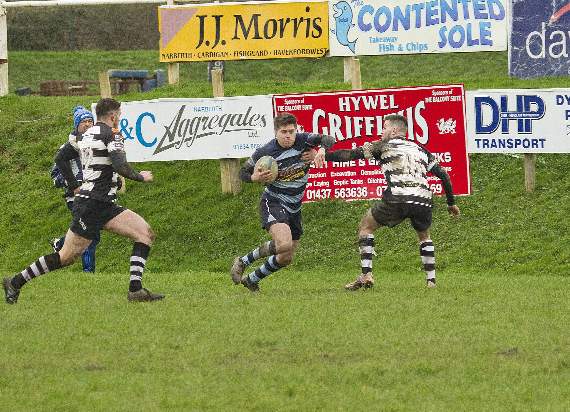 Dafydd Pritchard racing towards the Cross Keys line. Pic Elwyn Davies