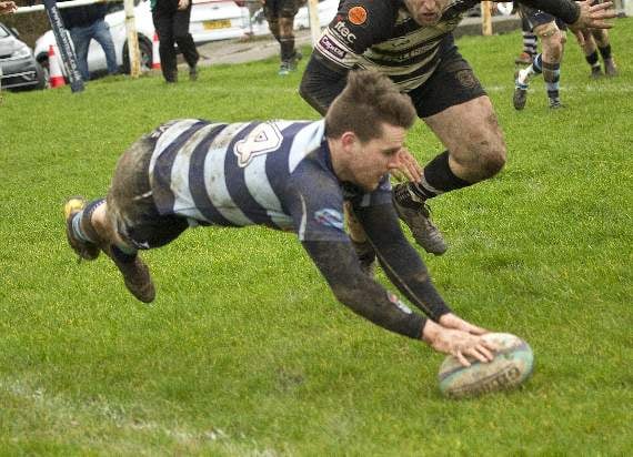 Wing Dafydd Pritchard safely scoring for the Otters. Pic Elwyn Davies