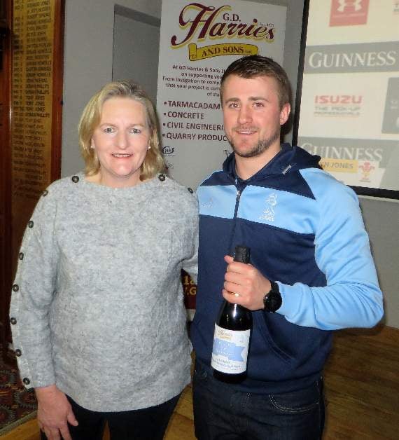 The G D Harries Balcony Suite Match Sponsors Cross Inn Clarbeston Road Man of the Match was Lanto Griffiths who is given a Bottle of G D Harries Bubbly by Vanessa Slater. Pic Stephen Thomas