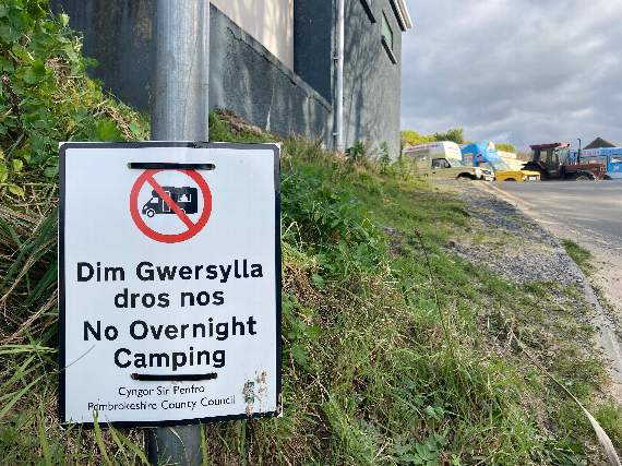 No overnight camping signs at Tenby’s South Beach car park.