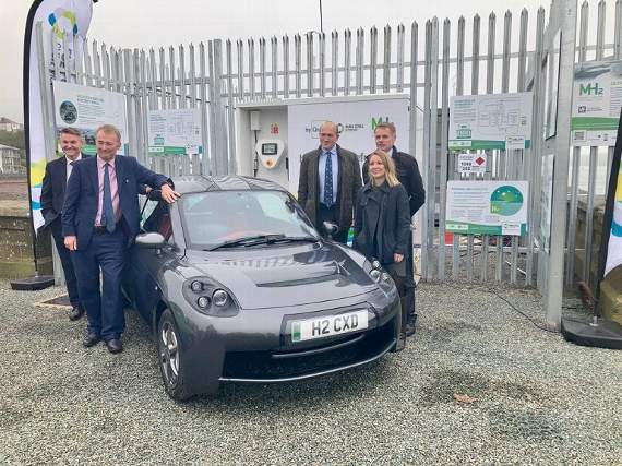Pictured are Simon Hart MP, Secretary of State for Wales (front with arm on car); Steve Edwards, Commercial Director, Port of Milford Haven; Will Bramble, Chief Executive of Pembrokeshire County Council; Steve Wyatt, Director of Research and Innovation Offshore Renewable Energy Catapult; Sophie Kempthorne, Innovation Lead, Prospering from the Energy Revolution Challenge.