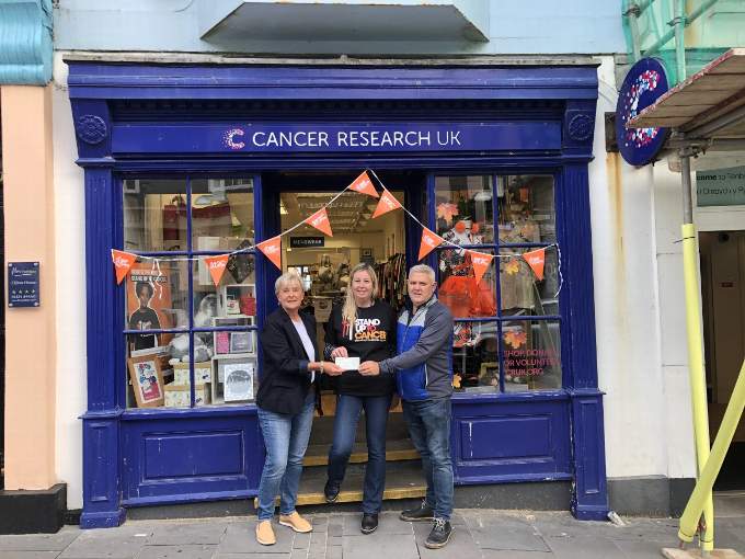 Trefloyne captains Jane Meyrick and Glen Hunter presenting a cheque to Sally Turner, Assistant Manager.