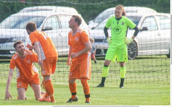 Mushet goalscorer Curtis Whatley gets to his feet after being mobbed by delighted team-mates.