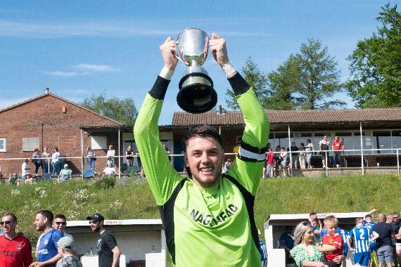 Longhope's captain Rhys Gardner with the Geo Sandoe Cup.