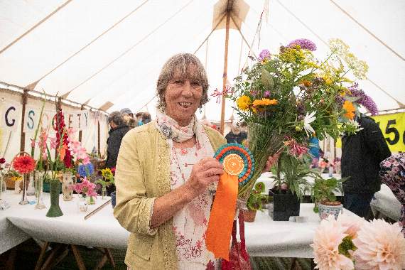 Show president Diana Standing with the best flower display which was entered by Louise McGuinness.