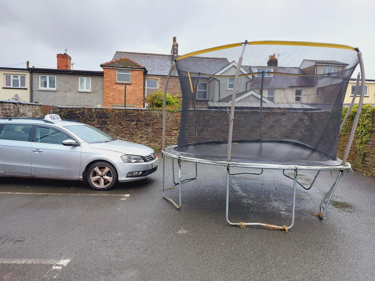 A trampoline landed in Llanfaes carpark on Orchard Street, Brecon, during Storm Eunice