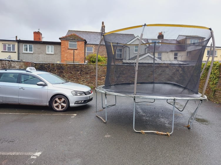 A trampoline landed in Llanfaes carpark on Orchard Street, Brecon, during Storm Eunice
