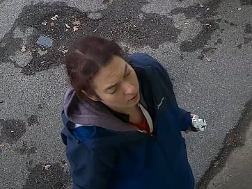 Police CCTV image of woman wanted for vandalising MP Jeremy Hunt’s office in Hindhead