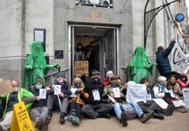 Extinction Rebellion protesters seal off bank on its last day in town