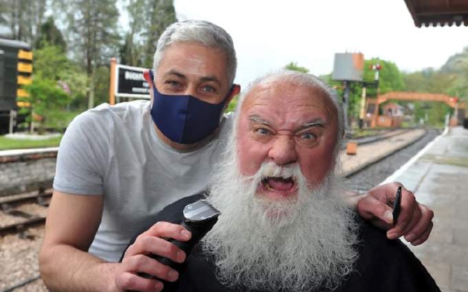 Dick Wood gets a beard shave after 14 months of lockdown.