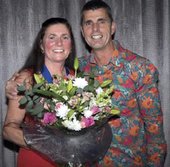 Tina Caunter collects her Life Membership bouquet from Roger Hayes