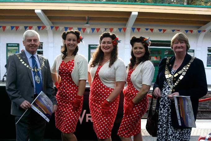 Cllr Jeff Trail, chairman Devon County Council and Cllr Caroline Mott, Mayor West Devon Borough Council with The Hummingbirds close harmony trio - Grace, Bettie and Clara. SR 4690