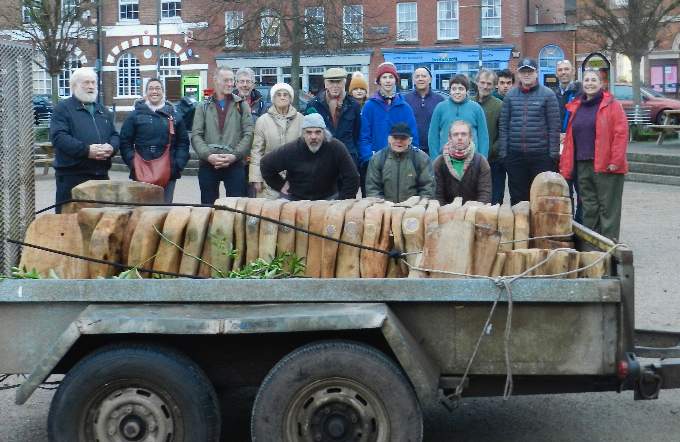 Some of the people involved in the bench making with Nik Pitcher (third row, far right) and James Bond (third row fourth right) from Carving Community CIC. NP 160122 01