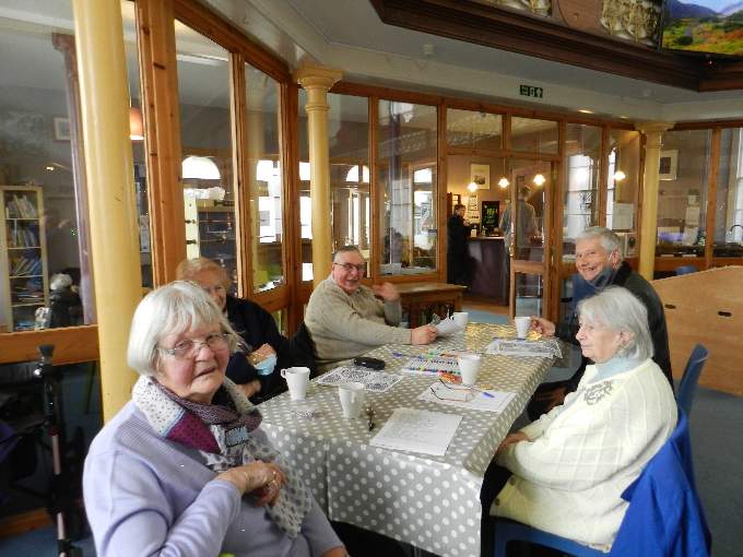 People enjoying activities over a cuppa at Crediton Congregational Church. NP 040222 04