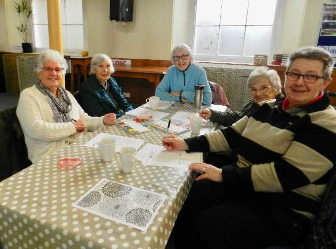 A group of ladies enjoy at cuppa and a chat at Crediton Congregational Church. NP 040222 02