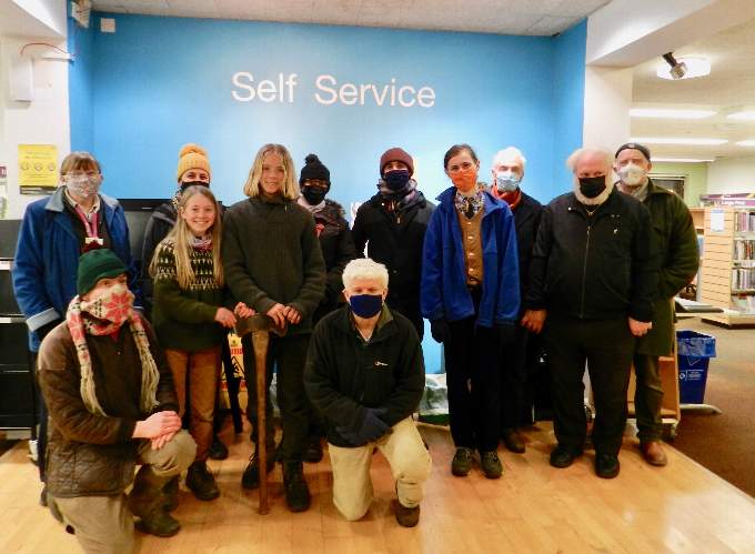 Those attending the official opening of the benches now situated in the Crediton Library Community Garden with Crediton Library supervisor Sue Lee (second row, first left) Nik Pitcher (second row, second left) and James Bond (second row, first right) both from Carving Community. NP 190122 01