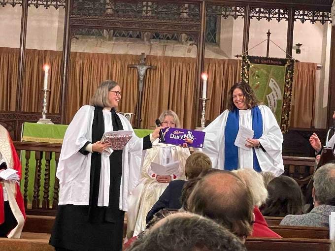 Rev Janet May is handed the giant bar of Cadbury’s chocolate from the Cadbury Deanery by Deanery Lay Chair, Laura Armstrong. AQ 2934