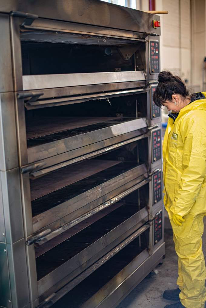 Kate surveys the fire damaged oven