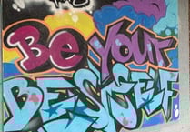 Academy students graffiti motto