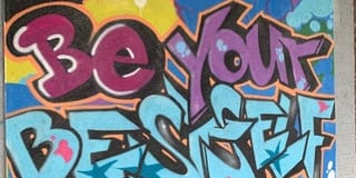 Academy students graffiti motto