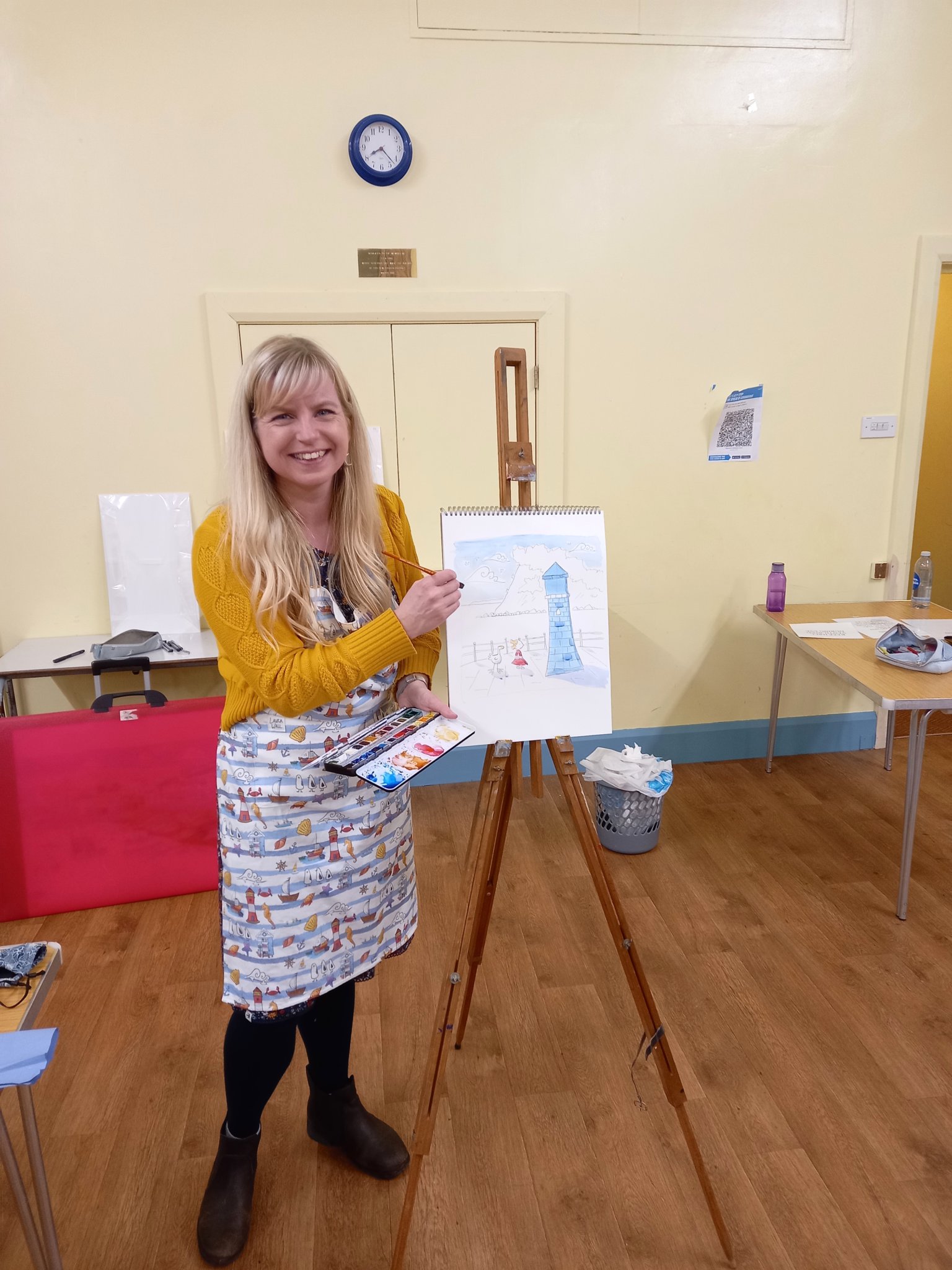 ARTIST AT WORK: Laura Wall demonstrating how to draw and paint the lighthouse and Ness to the Guides.
Picture: 1st Teignmouth Guides (Feb 2022)