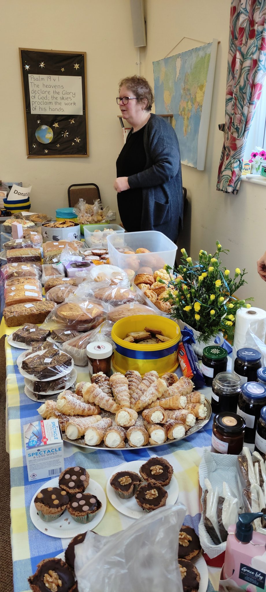 Martin Perry, above, with Viktor Ieromin; Tracey Barratt with the cakes; eight-year-old twins give their pocket money to the cause.