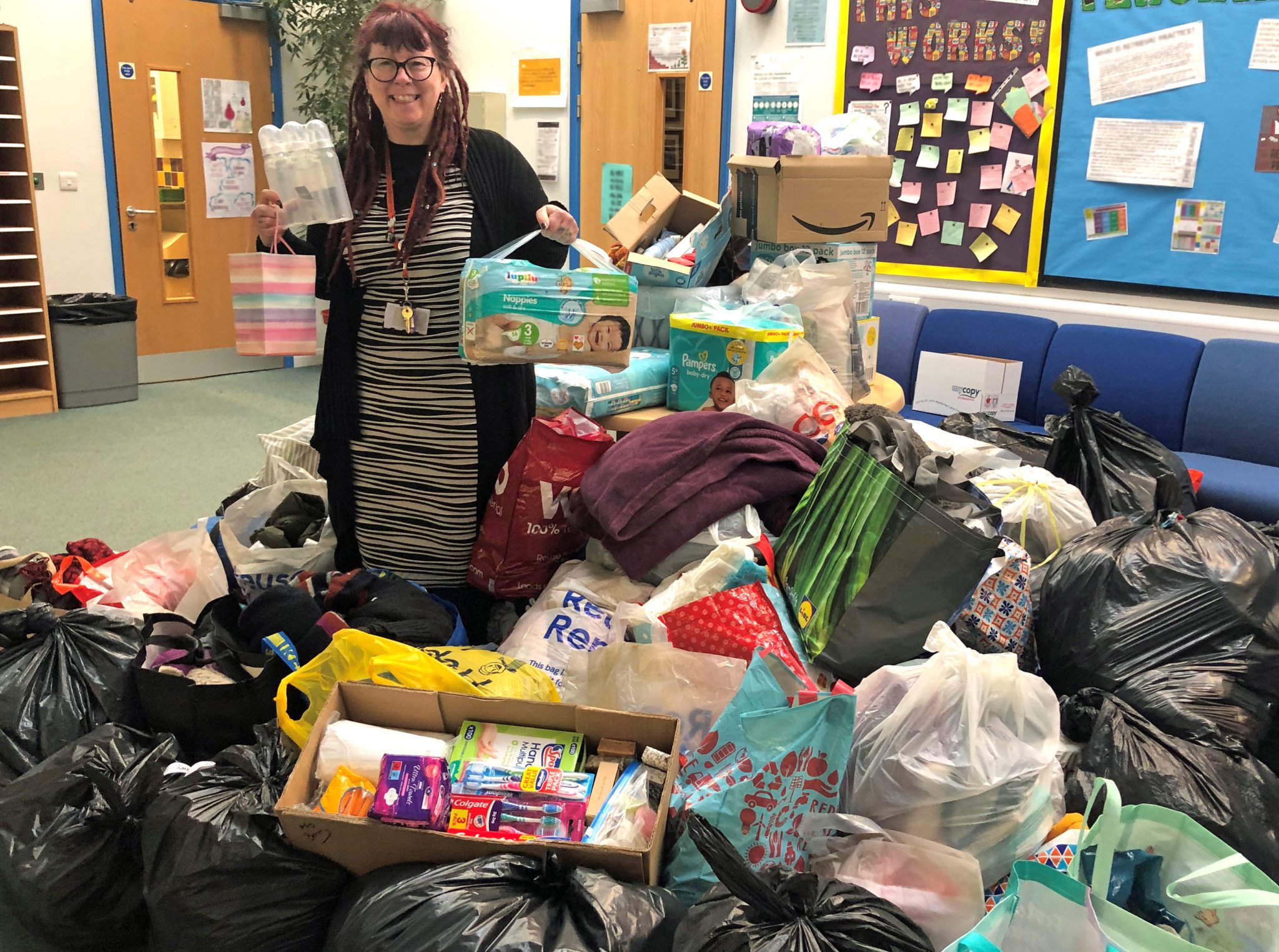 n Martin Coates, Alex Lyne, Layla Meredith-Morgan, Skye Burcher and Jaya Wylde supported the non-uniform day at The Dean Academy. Below Kat Berry with some of the donations.