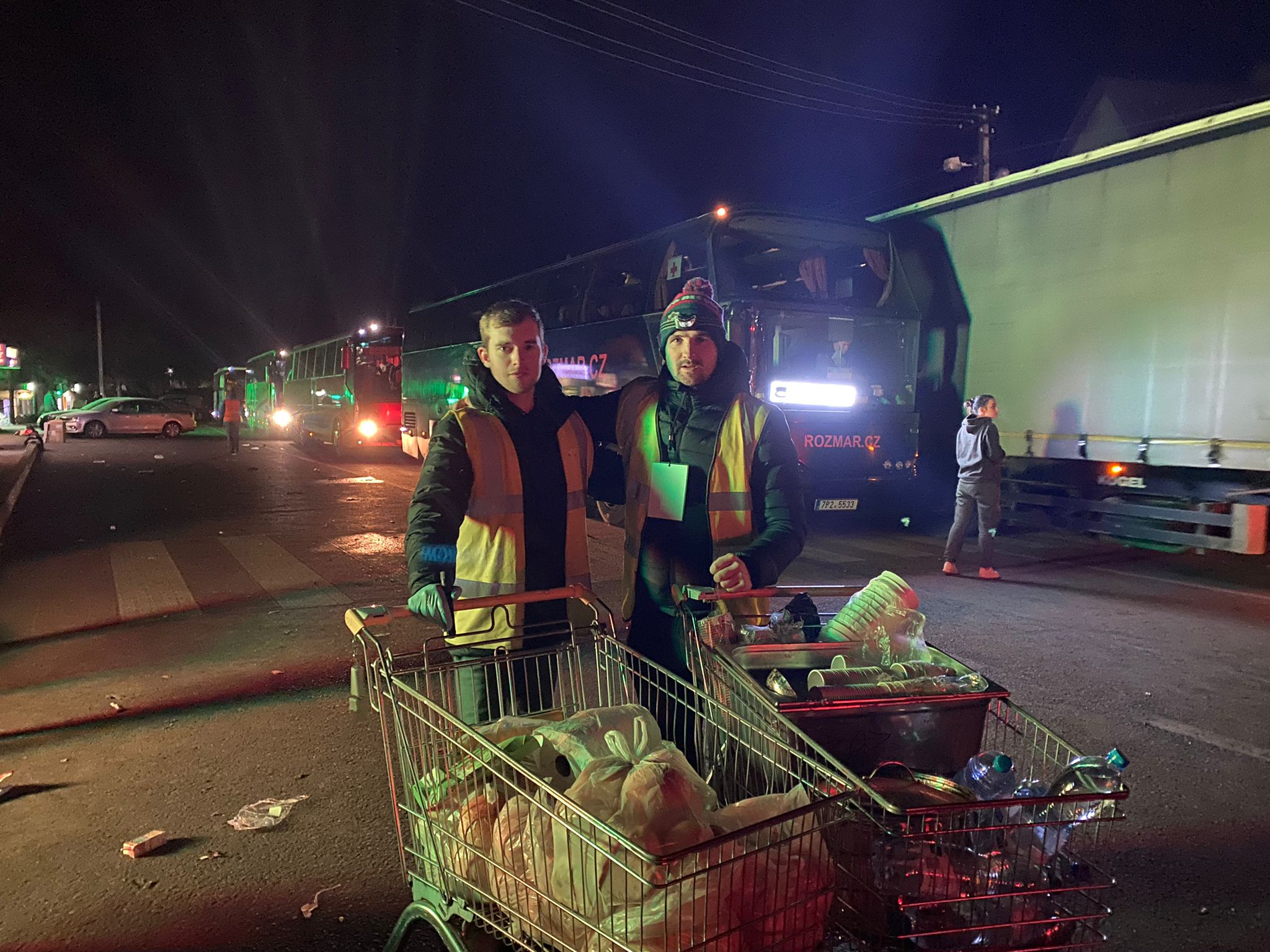 Dom and Nathan with shopping trollies full of supplies for refugees and volunteers at the border