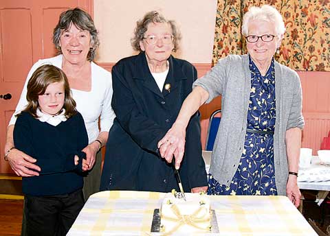 CAKE CUTTING: Cutting the cake made by Elizabeth Squire are: Millie Paddon, Elizabeth Squire, Monica Vivian and Doreen Buckingham.