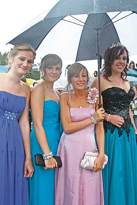 GRAND ENTRANCE: Despite the rain, Chloe Barnes, Lisa Crook, Ellie Massen and Alex Parker still managed to smile, before making their way into the Falcon Hotel.