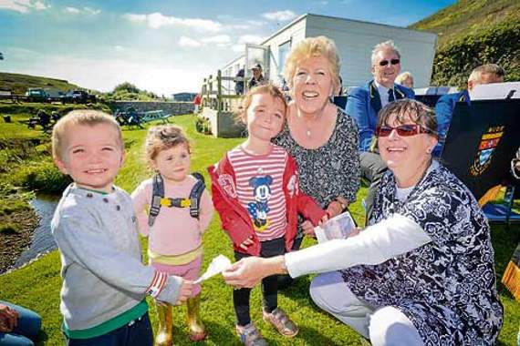 The youngest walkers who raised £175 for Cancer Research UK. They also donated £20 each to the Bude Town Band. They are from left: Mathew Prideaux, 4, Annabell Sharply-Goode, 2, and Shannon Prideaux, 5, with Margaret Frost and Brigit Inch of Bude Town Band. Picture: Studio Southwest, Bude