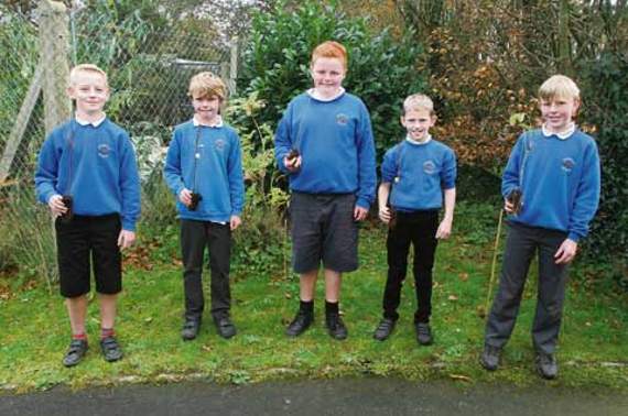Trees were planted by pupils at Otterham Primary School to mark Armistice Day. A certificate was awarded to those involved in the Woodland Trust’s trees donation as part of their centenary woodland project. The event was organised by the boys who are participating in the John Muir Award, which promotes conservation of the environment for the future enjoyment of the community. Pictured are some of the Otterham Primary School boys in the school garden, who organised the tree planting along with other children, staff, governors and community groups. From left holding their trees are: Will Collings (Birch), Ben Parsons (Elder), Jack Nute (Rowan), Max Quinn (Crab Apple) and Alfie Prout (Hazel). Picture: David Flower