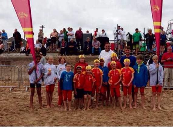 NIPPERS (Seven-13 years). From left to right are Ella Henry-Brock, Caja Sibley, Ellie Mallard, Jake Moran-Vanstone, Mitch Sibley, Chay Moran, Toby Mallard, Reuben Wright, Jago Sibley, Jacca Moran, Saul Barraclough, Zack Davis, Tony Gifford and Matthew Hopper. In the back row are Coaches Steven Gifford and Johnny Wright. Not pictured: Peter Trowbridge.