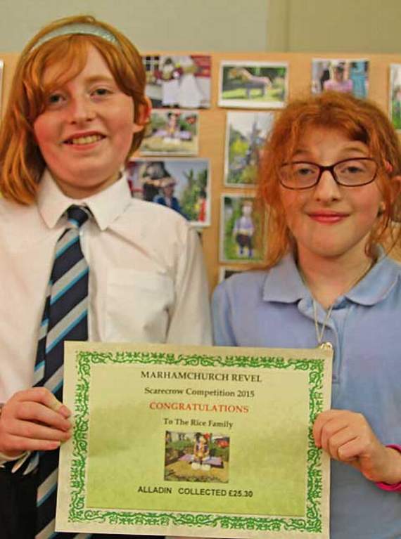 This year’s Revel scarecrow competition was won by the Rice family who raised £25.30 in donations from their scarecrow. Pictured above are Francesca and Lyllia Rice with their certificate. Picture: Paul Hamlyn