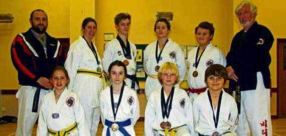 Back row from left to right are team coach Tom Douglas, Rachel Lovejoy, Ellis Wiffen, Marika King, Rowan Power, and club instructor Niall Grange. Front row from left to right are Jessica Lovejoy, Ella-Rose Petersen, Leo Wetherill and Josh Power.