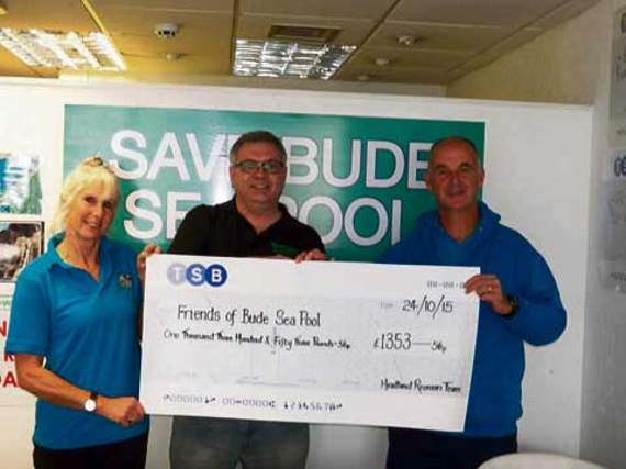 Paul Martin presents a cheque for £1,353.56 to the Friends of Bude Sea Pool.