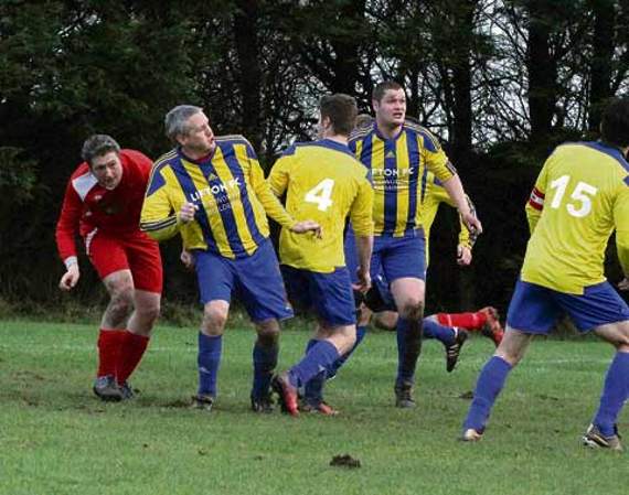 Lifton’s Loz Cromack and Dan Hoare have their eyes fixed on the ball as another St Breward cross comes in but it eventually sails over everyone’s heads and out for a goal kick. Picture: David Flower