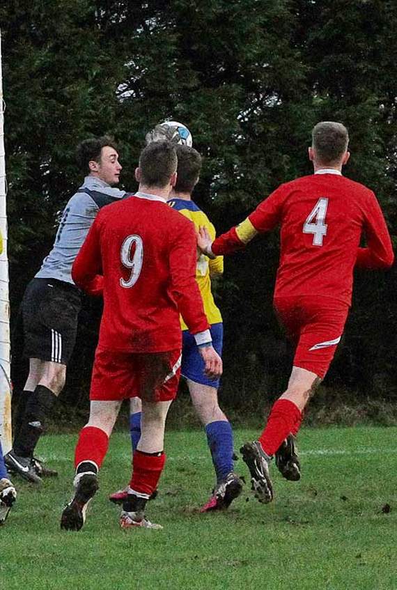 Lifton goalkeeper Chris Hoare safely collects the ball from a ruck of players in the goalmouth. Picture: David Flower