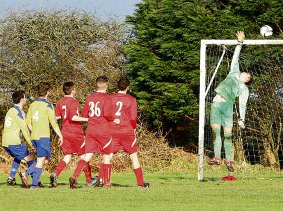 Number 16 for Lifton Dan O’Donavon sees his powerful header tipped over the bar in one of the closest chances of the Division Two clash that ended goalless. Picture: David Flower