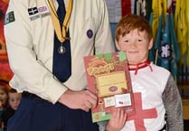 Scouts, Cubs and Beavers parade through the streets