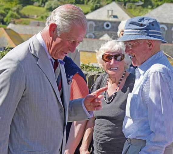 Prince Charles meets some local faces on the royal couple’s visit to the harbour village. Picture: Adrian Jasper