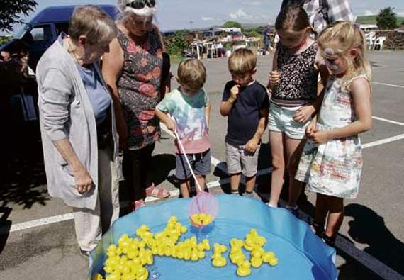 This boy had a good catch of three ducks but sadly none were winning ones. Picture: David Flower