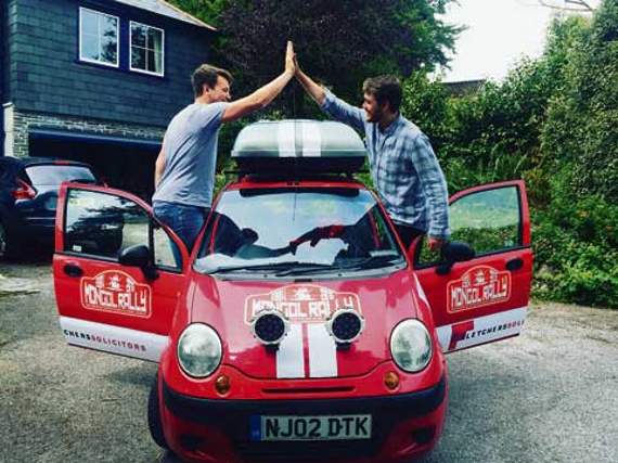 Ed Blackwell (left) and Mike Parlby (right) show they’re united ahead of their epic trip across Europe and Asia in a tiny 0.8 litre Daewoo Matiz.