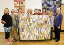 Bittersweet moment for Boscastle Craft Circle members as they auction quilt for Motor Neurone charity
