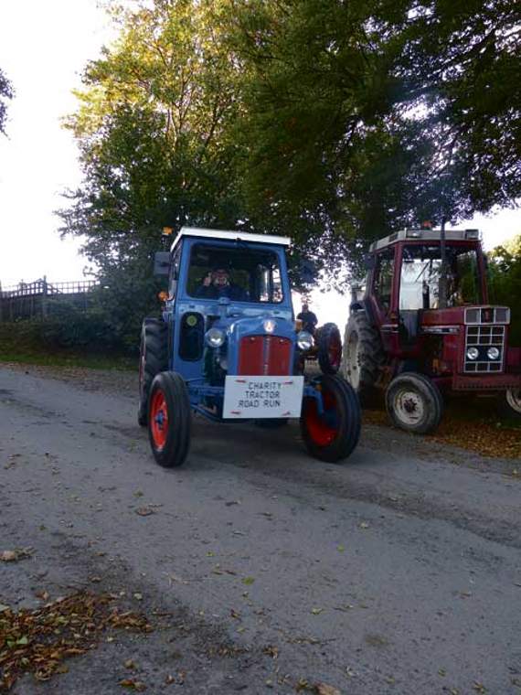 Organiser of the ‘Charity Tractor Road Run’, Bill Bernard, giving a thumb up to the camera as he sets off with the convoy of vintage tractors. Picture: Elias O'Neill