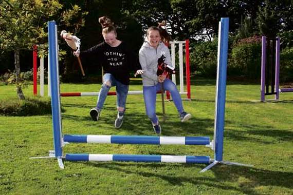 Taking part in the hobby horse gymkhana are Issy May and Beth Down. Picture: Dawn Bewes