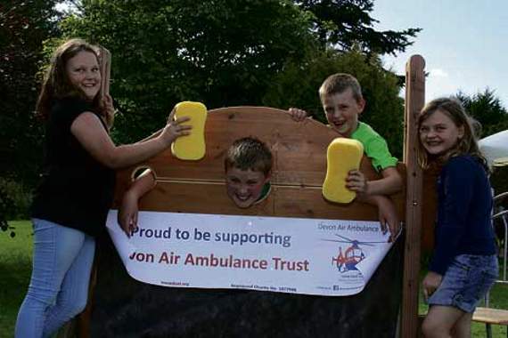 With their wet sponges in aid of charity are Lily Denning, Max Jordan, Rocco Jordan and Grace Denning.