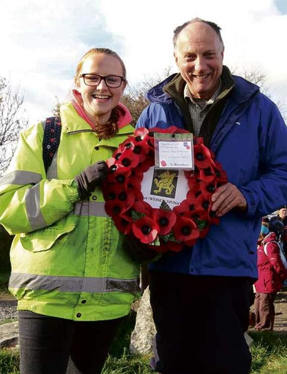 Olivia Ferguson and Vaughan Willaims (Camelford RBL committee), hold the wreath to be placed by the memorial on the top of Roughtor. Picture: David Flower