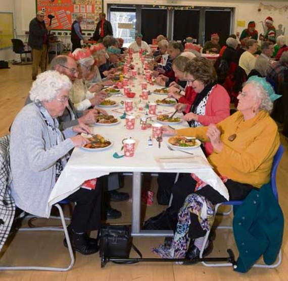 Rows of people sat down for a Christmas lunch. Pictures: Adrian Jasper