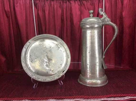 Ecclesiastical pewter — flagon and plate.